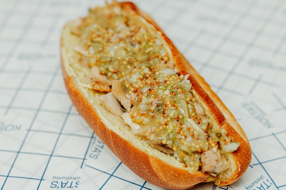 The sweet mustardy tang on the chicken roll comes from the house cultured mustard butter and a “condiment sauce”. 