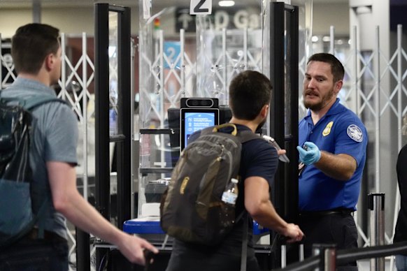 A TSA staff member at a check point at Harry Reid International Airport in Las Vegas.