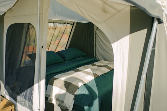 Walkers sleep under the stars in a bed that’s more at home in a hotel.