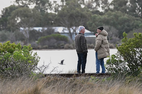 David Kenwood and David Connoley strolling the shore of Lakers Cutting. 