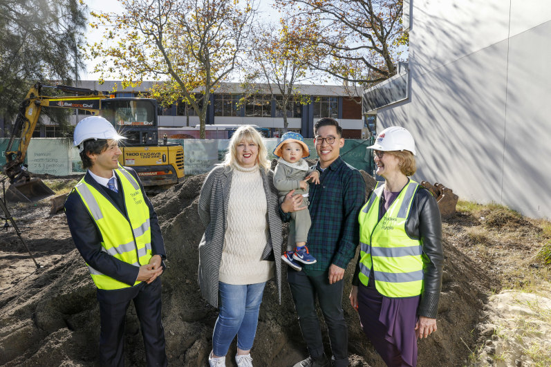 Developer Charles Daoud, affordable housing tenant Jo Fisher, private buyer Paul Tran and his son Pax, and Housing Trust CEO Michele Adair at the site of Northsea in Wollongong.