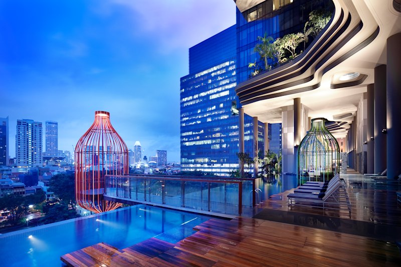 The swimming pool and cabanas on the fifth floor of Parkroyal on Pickering.