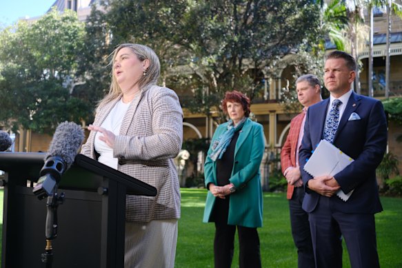 National Association of Women in Construction Queensland chapter president Emma McCaughey and Queensland Major Contractors Association chief executive Andrew Chapman, second from right, fronting media with government ministers on Friday.