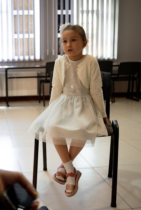 Elena, just 6½ years old and dressed like a little princess, finds solace in play and routine.