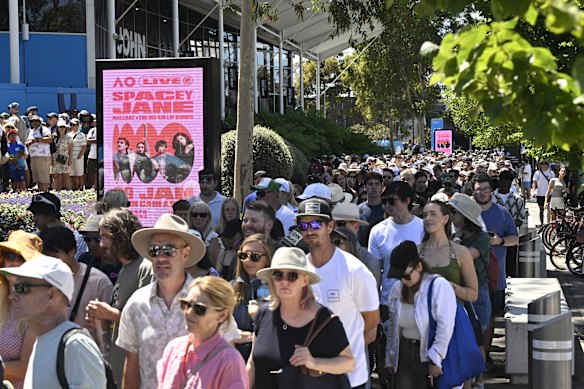 Fans wait in long queues outside the Grand Slam Oval entrance for day one of the Australian Open.