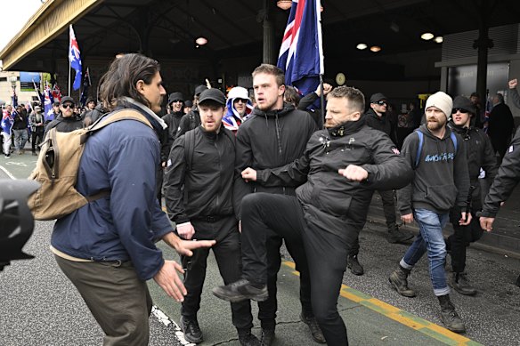 A clash with a counter-protester outside Flinders Street Station.