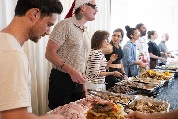 Volunteers handing out food at the Bondi Surf Bathers Life Saving Club’s Christmas lunch. 