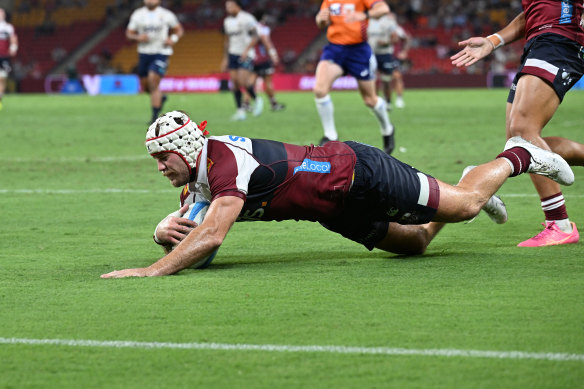 Fraser McReight goes over to score for the Reds against Moana Pasifika on Friday night.