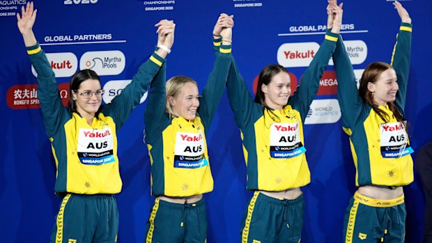 Silver medallists team Australia pose on the podium after the women’s 4x100-metre medley relay final