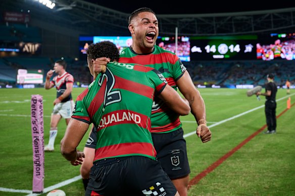 Latrell Mitchell and Isaiah Tass celebrate the match winner in the meeting between the arch-rivals in April.