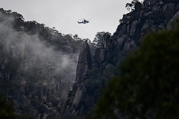 A Victoria Police helicopter flies over Mount Buffalo National Park searching for Dezi Freeman. 