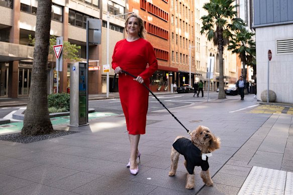 Gina Edwards and Oscar outside court in 2024.