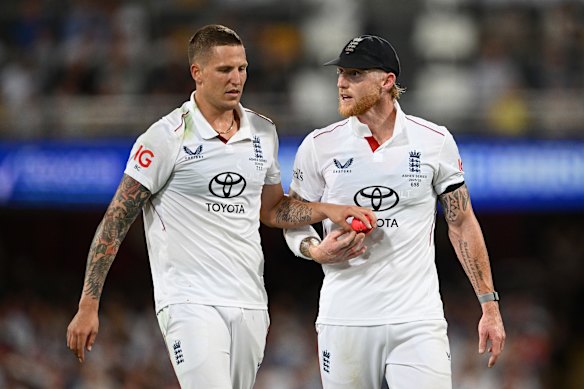 Brydon Carse and Ben Stokes at the Gabba.