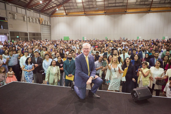 Home Affairs Minister Tony Burke with hundreds of new Australian citizens at Sydney Olympic Park on Saturday.