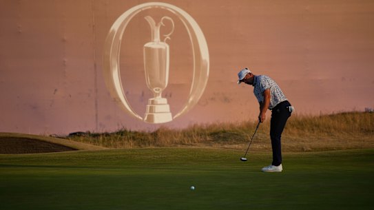 Lucas Herbert of Australia putts on the 18th green during the third day of the British Open. 