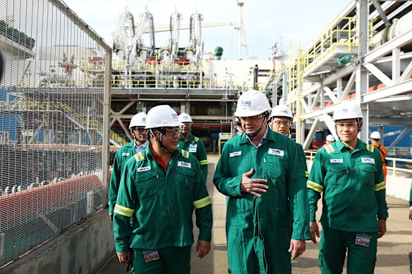 Chief executive of Singapore LNG Corporation Leong Wei Hung (left) with Anthony Albanese during a tour of the company on Jurong Island.
