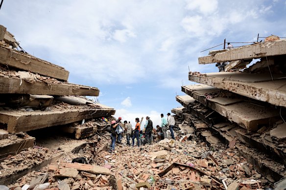 Rescuers continue to search for victims and work at a collapsed building in Carabellada days after twin magnitude-7 quakes struck Venezuela.