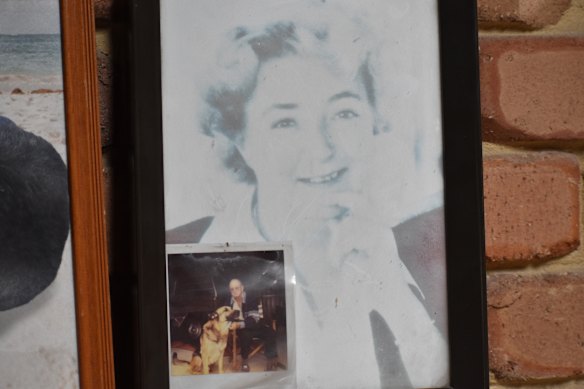 A photo of Steven Wrightson’s mother and his father sits on his mantlepiece, along with the family’s German Shepherd Jack.