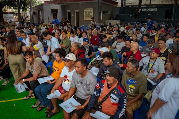 Tricycle drivers queue in Manilla to receive cash aid, amid rising fuel prices caused by the US-Israel intervention in Iran, on March 17.