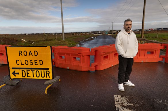 Thornhill Park resident Zak stands at the Alfred Road closure, which has added 45 minutes to his journey to collect his daughter from daycare.  