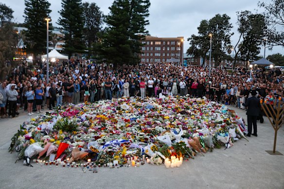 Mourners at a vigil at Bondi Pavilion on Monday.