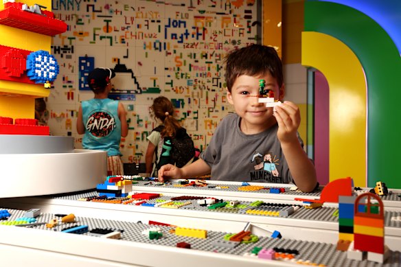 Phoenix Gye, six, is building a jet for two brothers bound for Africa, where they will relax at a hotel. He wants to be a Lego master builder when he grows up.