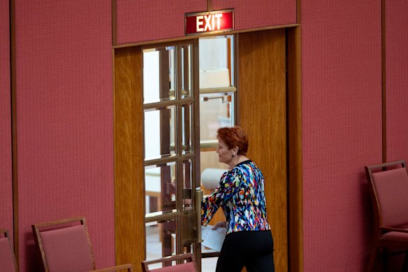 Senator Pauline Hanson leaves the Senate after being suspended for seven days.