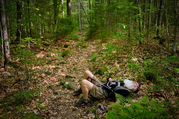 Appalachian Trail hiker Dale Sanders, 91, takes a brief power nap near Monson, Maine.