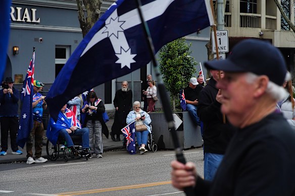Anti-government protesters gather at the corner of Bourke and Spring streets on Saturday. 