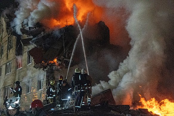 Firefighters tackle a fire after a Russian missile strike in Kharkiv last week.