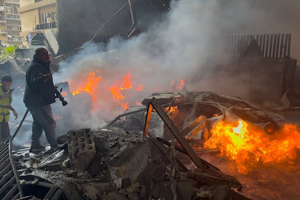 Burning cars at the site of Israeli airstrike in Beirut on Wednesday.