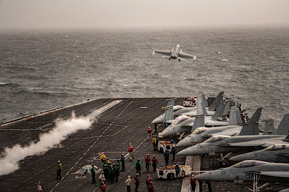 An F/A-18 Super Hornet takes off from the flight deck of the Lincoln in 2019.