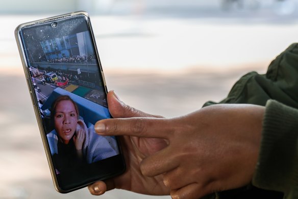 Verador shows a video of her escaping from the building fire, carrying the boy.