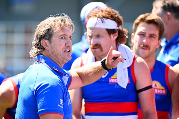 Western Bulldogs coach Luke Beveridge takes his players through their paces in a pre-season hitout against the Swans at Whitten Oval back in February.