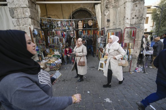 Pedestrians walk outside the in the Al-Hamidiyeh market in the old walled city of Damascus, Syria.
