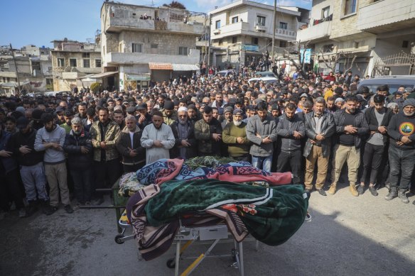 Males in the village of Al-Janoudiya  during the funeral of four Syrian security force members killed in clashes with Assad loyalists in  coastal Syria.