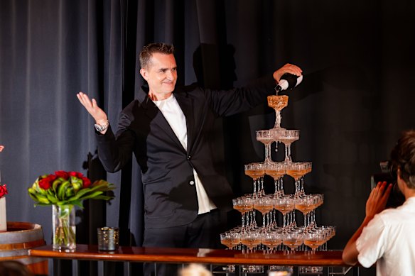 MAFS expert John Aiken pours a champagne tower.