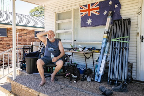 Keith Greenbank swelters outside his house in Penrith in 40-degree heat on Friday.