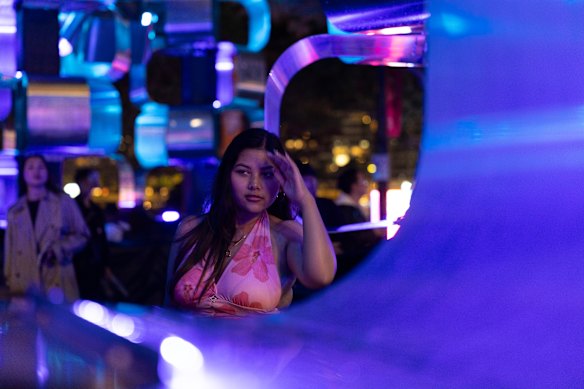 Note the person in the frame draws your eye, with the cubed light installation being pushed to the background.
