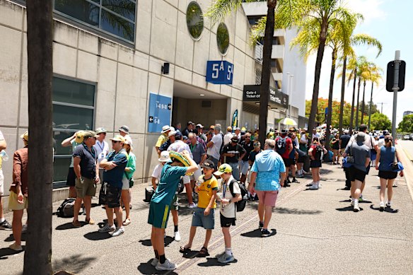 Spectators arrive at the Gabba on Thursday for the second Ashes Test.