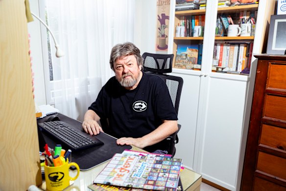 Tim Mendham in his study with copies of The Skeptic.