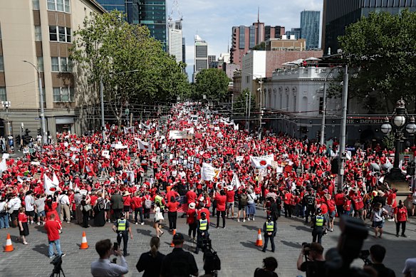 Teachers and staff from Victorian state schools rally outside parliament on March 24.