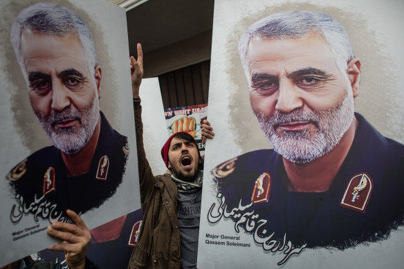 People hold posters of slain Iranian Revolutionary Guard Major General Qassem Soleimani during a protest outside the US Consulate in Turkey in 2020. Soleimani was assassinated by the US in a drone strike.