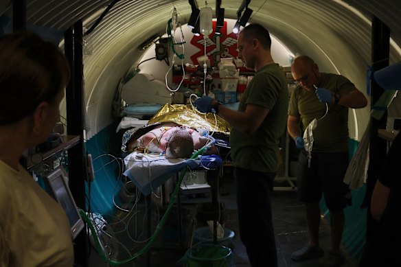 Military medics treat a wounded Ukrainian soldier in the field hospital in the Zaporizhzhia region, Ukraine, last month.