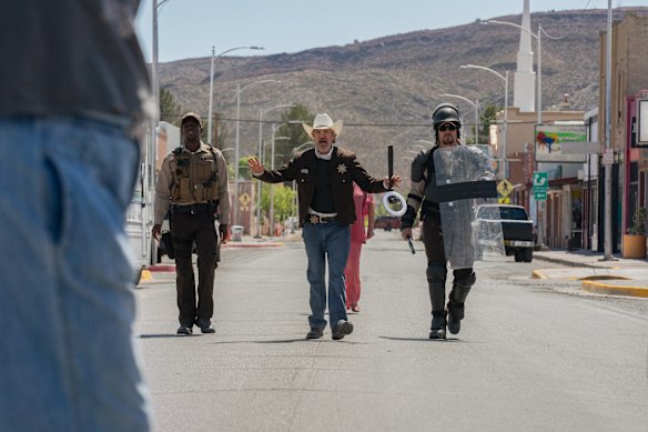 Joaquin Phoenix (centre) is the sheriff who picks and chooses which rules to enforce in Eddington.