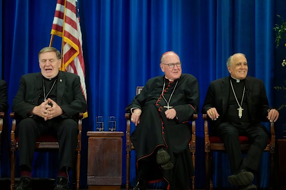 Cardinal Timothy Dolan, centre, with fellow US cardinals Joseph Tobin and Daniel Di Nardo, address the media after electing the pope.