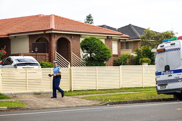 Police outside the Bonnyrigg home of Bondi gunmen Naveed and Sajid Akram.