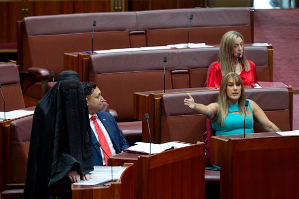 Senator Lidia Thorpe reacts to Hanson wearing a burqa in the Senate.