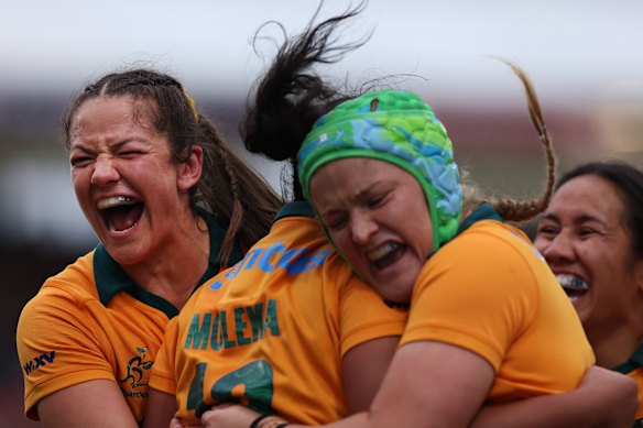 Michaela Leonard (left) celebrates with Faitala Moleka and Lily Bone after Moleka’s try against Scotland.