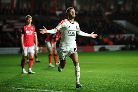 Jorge Grant celebrates a goal for Salford City against Walsall.